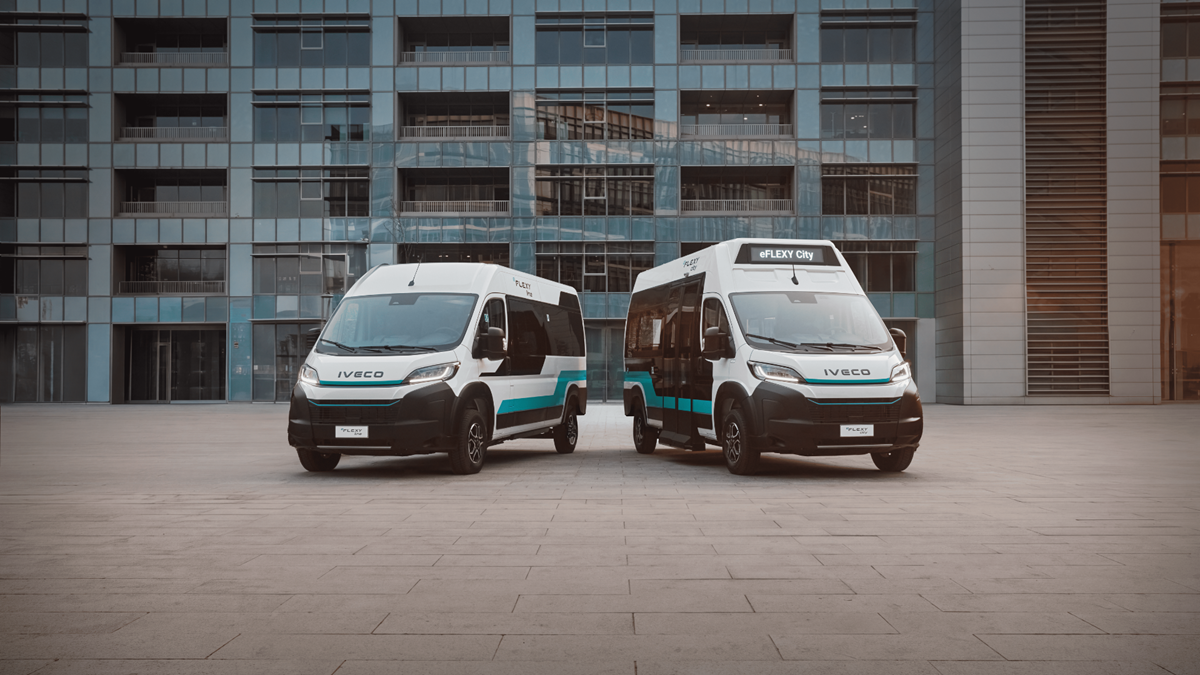 IVECO eFLEXY Line and City — manufacturer image IVECO eFLEXY Line and City electric minibuses side by side, with their front windscreens and passenger-side glazing visible.
