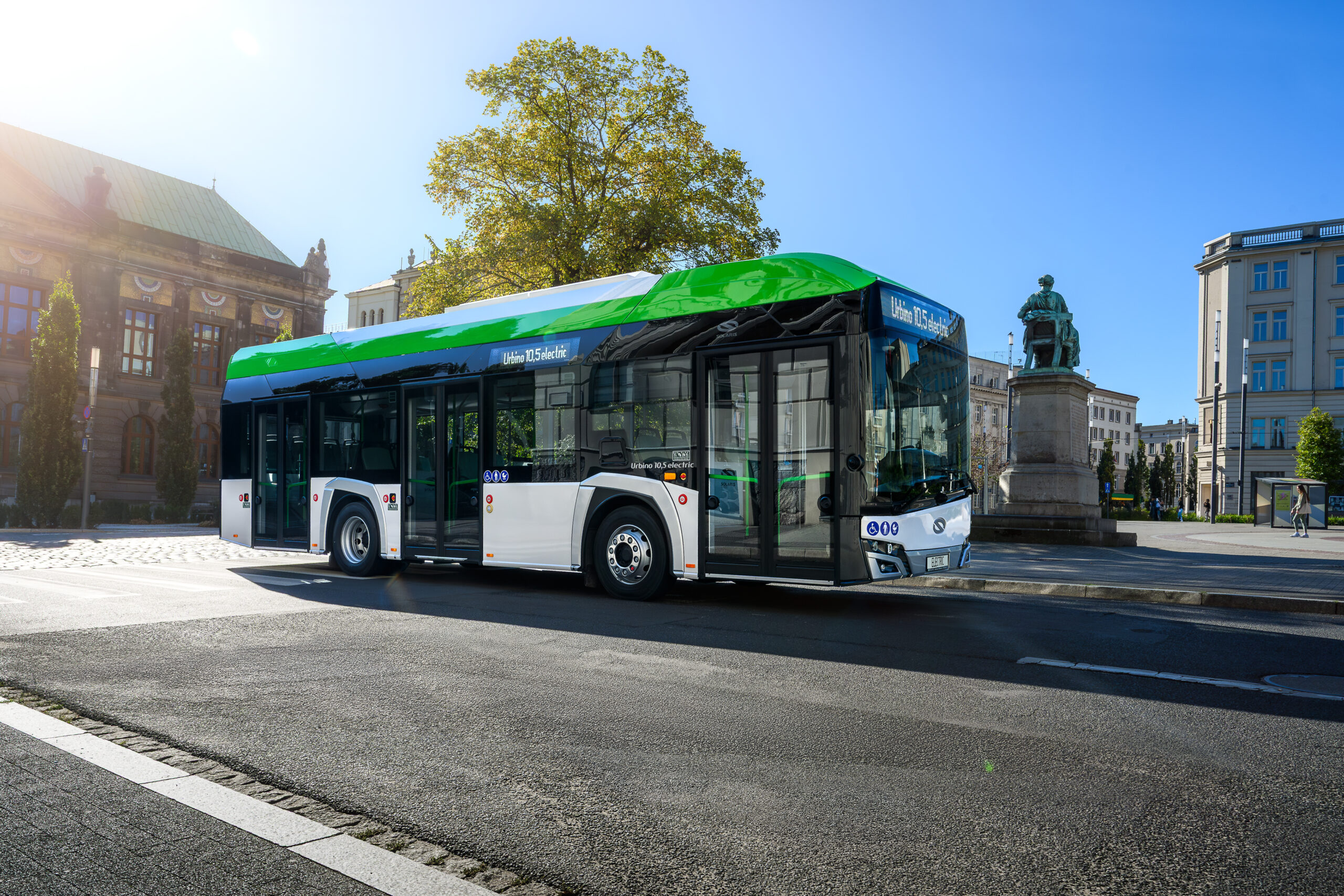 Solaris Urbino 10.5 electric in a city square, showing its front windscreen, doors and passenger windows.