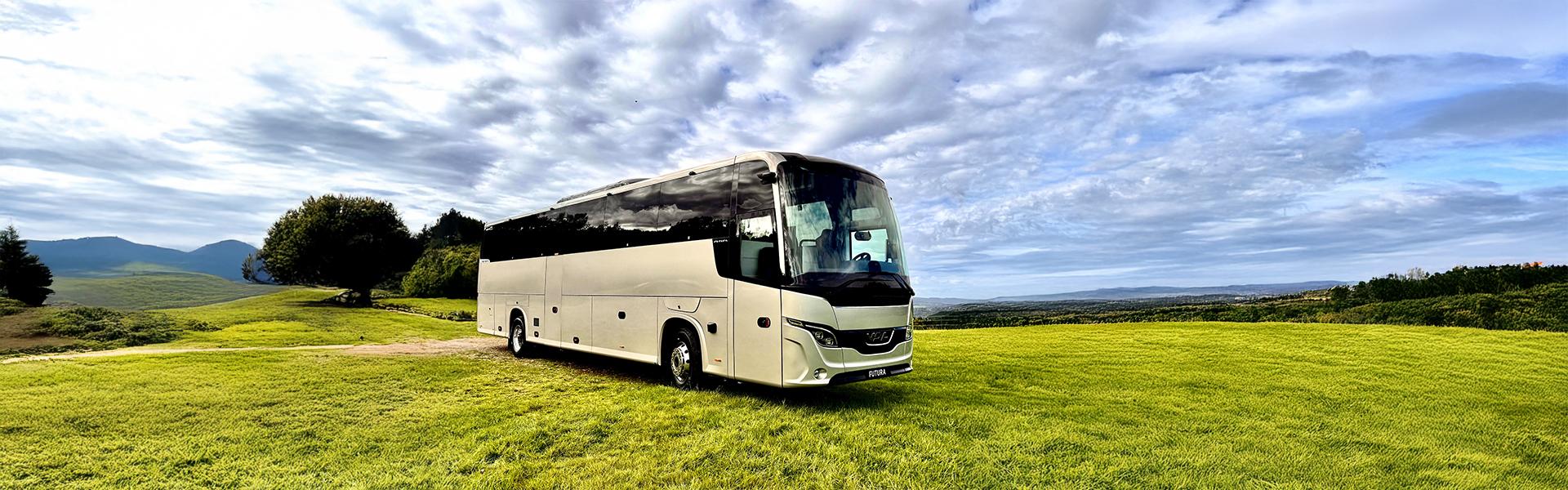 VDL Futura 3 — manufacturer exterior photograph VDL Futura coach in a landscape, showing the front windscreen and continuous passenger-window band.